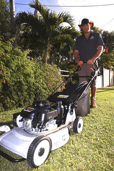 Lawn mowing Mackay — edged nature strip and driveway verge after mow-and-blow